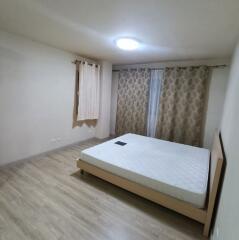 Bedroom with double bed and hardwood floor