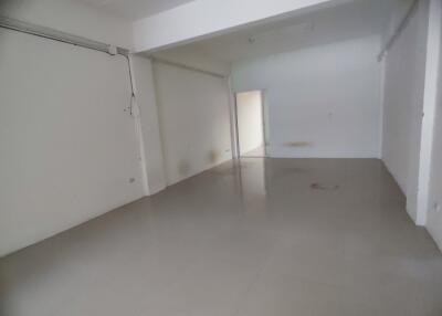 Empty living space with tiled floor