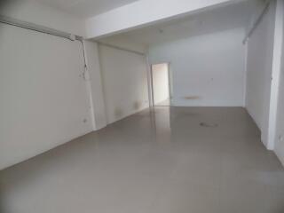 Empty living space with tiled floor