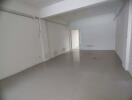 Empty living space with tiled floor