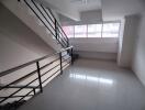 Staircase area with large windows