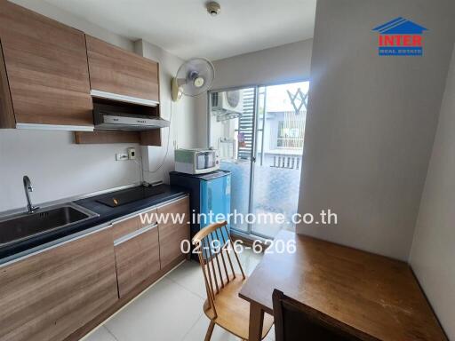 Modern kitchen with wooden cabinets and appliances