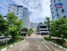 Exterior view of residential buildings with greenery and pathway