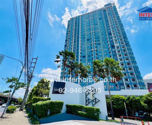 High-rise residential building exterior with landscaped surroundings