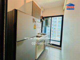 Modern compact kitchen with a view of the city