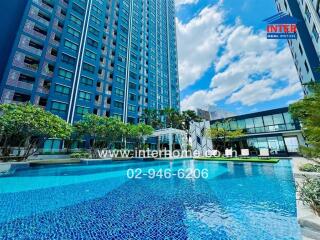 Modern condominium building with outdoor swimming pool and lounge area