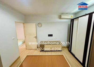 Empty bedroom with air conditioner and modern wardrobe