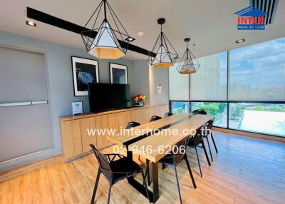 Modern dining room with large windows and stylish pendant lights