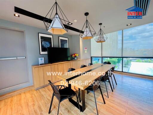 Modern dining room with large windows and stylish pendant lights