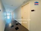 Bright hallway with tile flooring and multiple doors