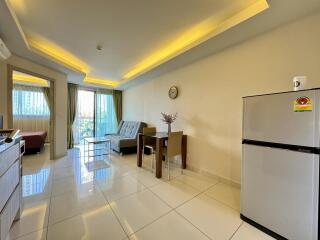 Spacious living area with modern furniture and natural lighting