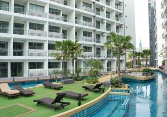 Modern apartment complex with pool and lounge area