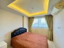 Bedroom with a double bed, air conditioning, and ceiling lights.