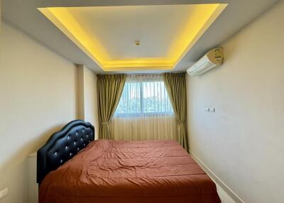 Bedroom with modern lighting and brown bed cover