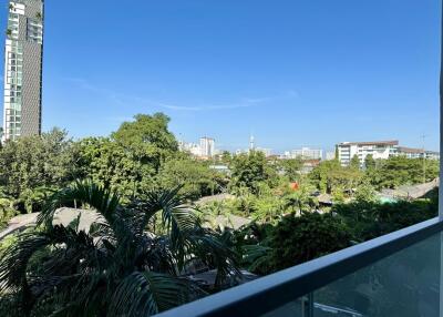 View from the balcony overlooking the cityscape and greenery