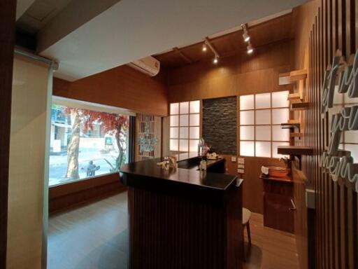 Modern kitchen with large window and bar counter