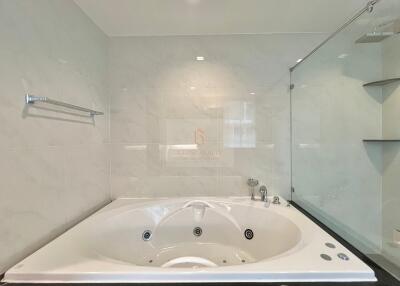 Spacious bathroom featuring a modern jacuzzi tub