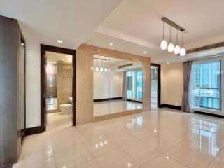 modern living room with tiled floor and large mirror