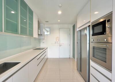 Modern kitchen with built-in appliances and sleek cabinetry