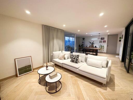 Modern living room with white sofa and coffee tables