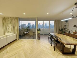 Modern living and dining area with city view