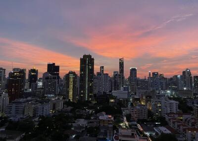 City skyline at sunset with high-rises and buildings