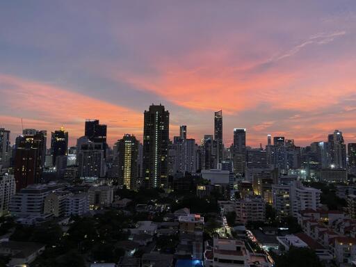 City skyline at sunset with high-rises and buildings