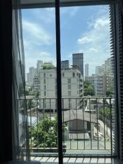 View from living room window with city skyline