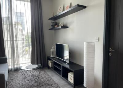Modern living room with TV and decorative shelves