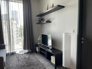 Modern living room with TV and decorative shelves