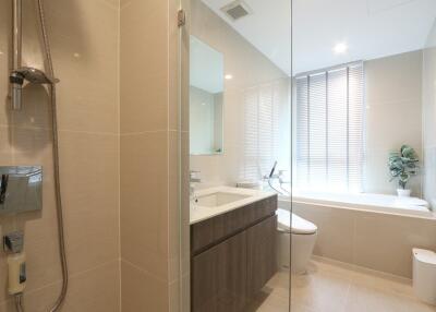 Modern bathroom with bathtub, shower, and sink