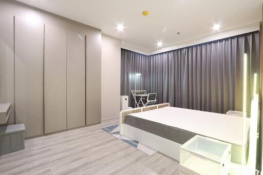 Modern bedroom with gray curtains and contemporary furniture