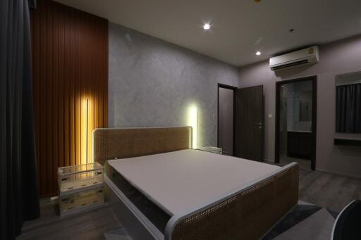 Modern bedroom with stylish design and lighting