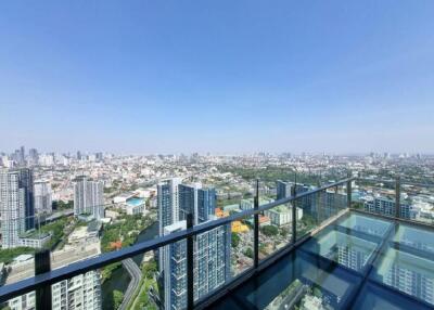 High-rise balcony with city skyline view