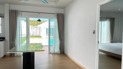 Modern living room with view of patio and pool