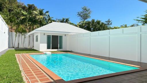 Outdoor area with pool and guest house