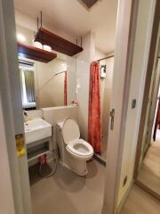 Modern bathroom with sink, toilet, and shower