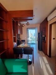 Modern kitchen with bar seating and city view