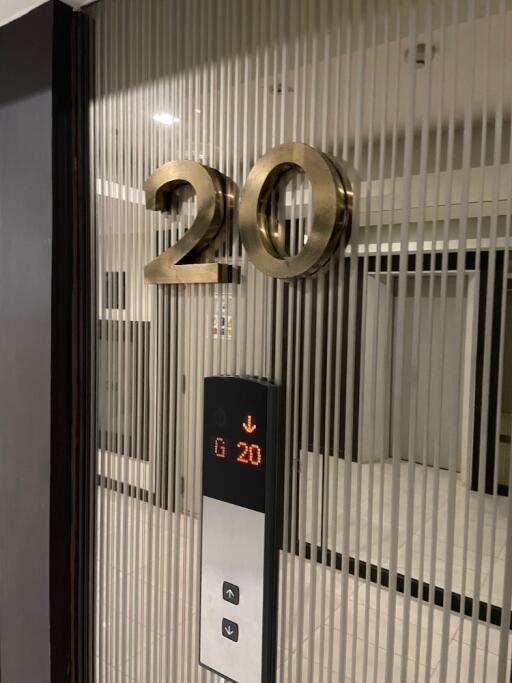 Elevator lobby showing a floor number 20