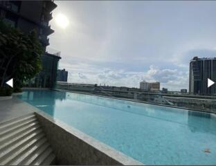 Swimming pool with city skyline view