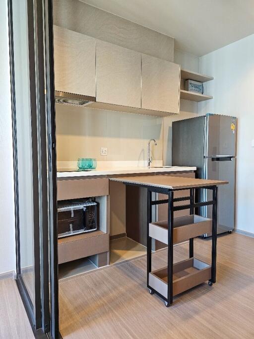 Modern kitchen with wooden cabinetry and island