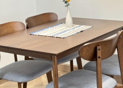 Dining area with wooden table and chairs