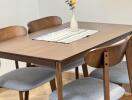 Dining area with wooden table and chairs