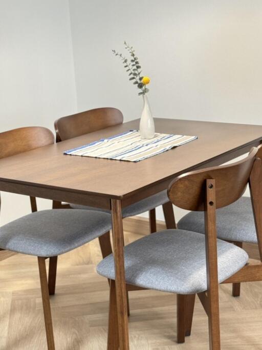 Dining area with wooden table and chairs