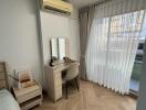 Bedroom with desk and large window