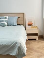 Bedroom with wooden bed frame and nightstand