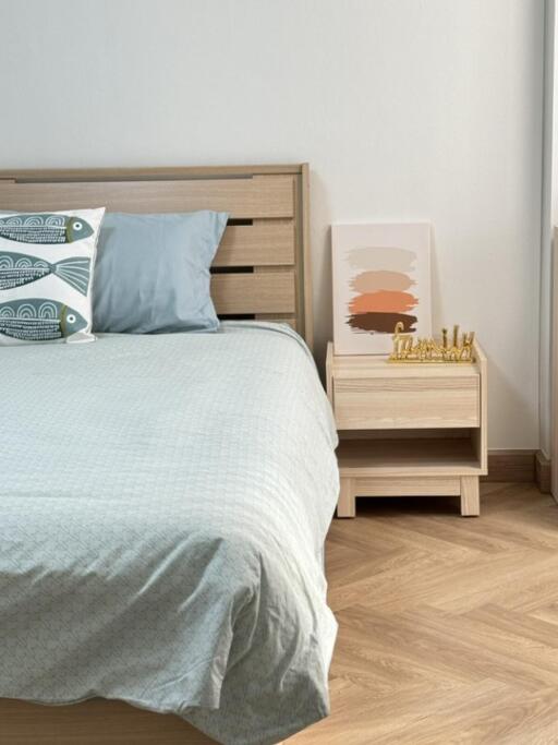 Bedroom with wooden bed frame and nightstand