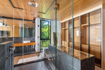 Modern bathroom with wood accents and glass shower