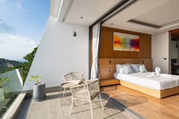 Modern bedroom with balcony and scenic view