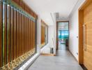 Modern hallway with large wooden slats and ocean view